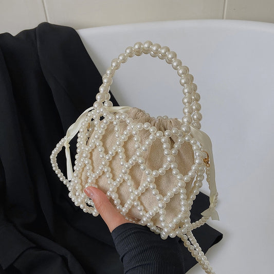 2022 New Niche All-match High-quality Beach Hollow Woven Pearl Acrylic Material Fashion Dinner Daily Crossbody Bags for Women